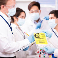 Healthcare workers checking medical equipment