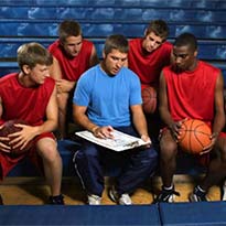 Coach discussing plays with students