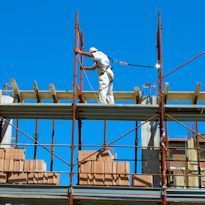 Worker installing supported scaffold