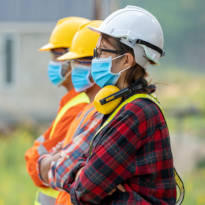 Three employees wearing face masks