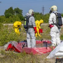 HAZWOPER workers wearing HAZWOPER Level B ensembles