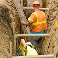 Worker in trench