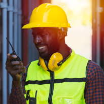 Construction worker on roof wearing fall protection