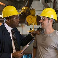 Manager talking with worker