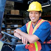 forklift driver sitting in forklift