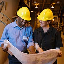 Two workers discussing a process