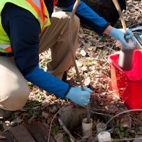 Industrial hygienist sampling biological contaminants in pipes