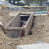 Excavation with ladder and trench box installed