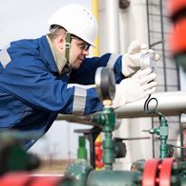 Worker checking pipeline pressue