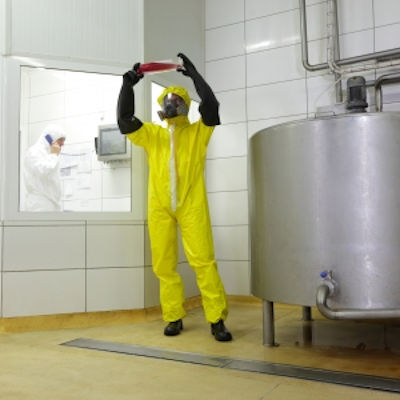 Image of employee checking chemicals