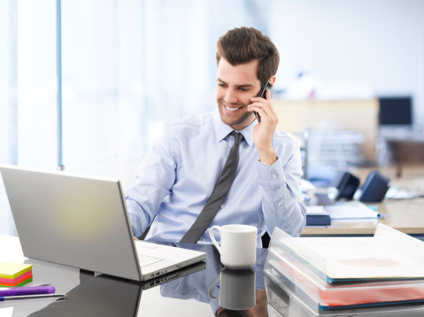 Image of office employee talking on the phone
