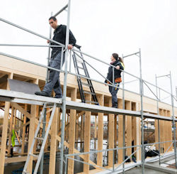 Construction site workers on a dangerous elevated service