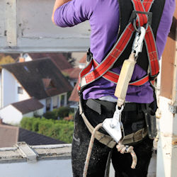Picture of worker wearing fall protection equipment.