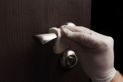 Picture of door knob being disinfected