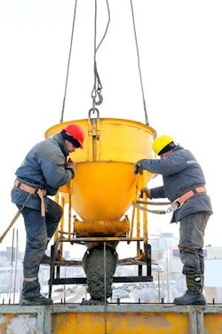 Two construction workers involved in one of the many risky jobs