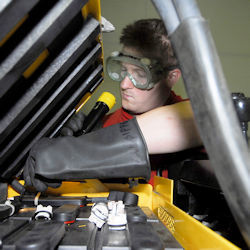 Technician maintaining battery