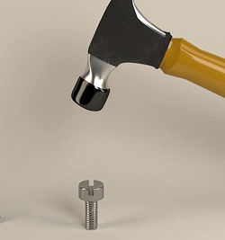 Hammer being used on a screw
