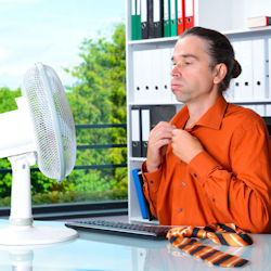 employee experiencing heat distress trying to cool off