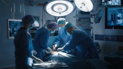 healthcare employees working on a patient in an emergency room