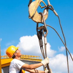 Rigger inspecting rigging prior to lift