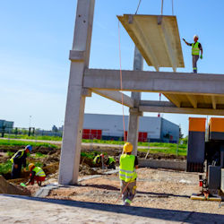 Image of workers working under suspended load.