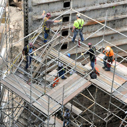 Workers on supported scaffold.