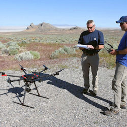 Workers performing maintenance on UAV unmanned aerial vehicle