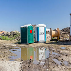 Two Portable Toilets on worksite
