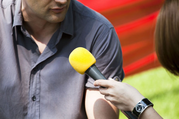 journalist interviewing a man