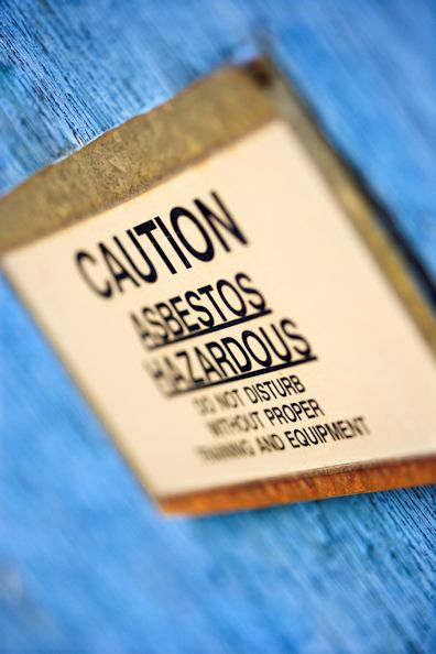Sign warning of Caution Asbestos Hazardous