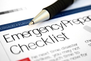 Pen sitting on a piece of paper with the title emergency preparation checklist