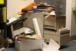 A messy office space signs of poor housekeeping.