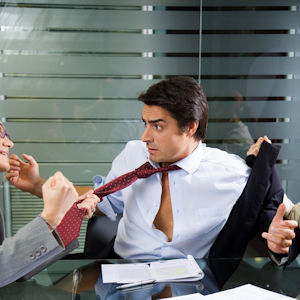 A worker in a meeting being assaulted.