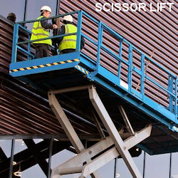 Two workers standing on a scissor lift 
