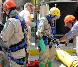 Confined space entry team preparing to enter the space.