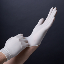 Persons hands with white PPE gloves
