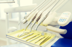 Dental tray in treatment room with instruments