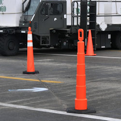 Tall orange tubular and cone markers
