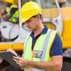 Worker conducting worksite analysis.