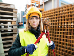 construction worker with bolt cutters