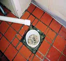 drainage pipe not aligned with drain in floor