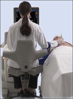 Tech performing an ultrasound on a patient.