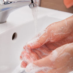 Image showing an employee washing hands