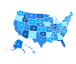 Back of man's head who is talking into a handheld radio.