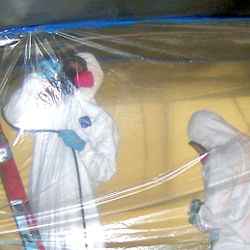 workers removing lead paint