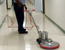 Janitorial engineer polishing the floor.