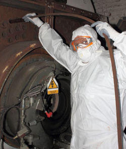 Workers wearing a combination of PPE to reduce exposure to hazardous chemicals