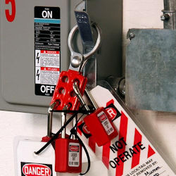 group lockout-tagout devices on electrical panel