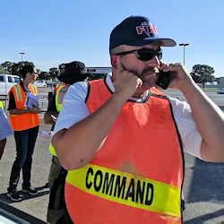 Incident commander outside talking on phone
