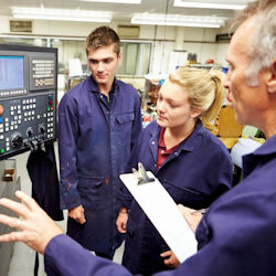 Image of supervisor conducting on the job training with employees